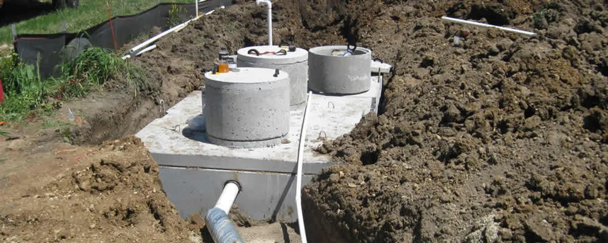 Septic system repair and installation site with tank access ports in Long Beach, CA