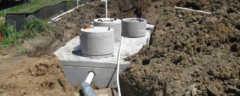 Septic system repair and installation site with tank access ports in Long Beach, CA