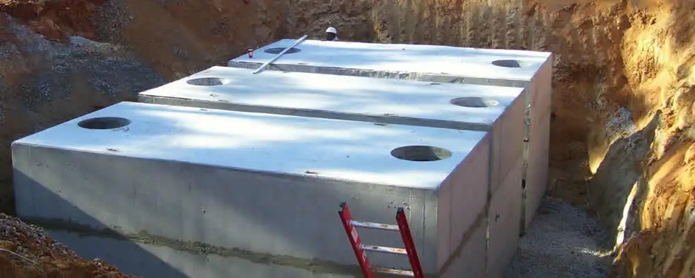 Septic tank installation site with a newly placed concrete tank in Long Beach, CA